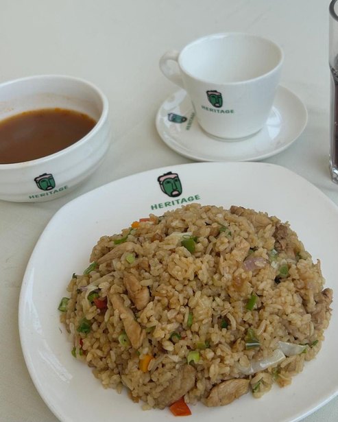 Chicken and vegetable fried rice served with soup and coffee at Heritage Hotels Arua